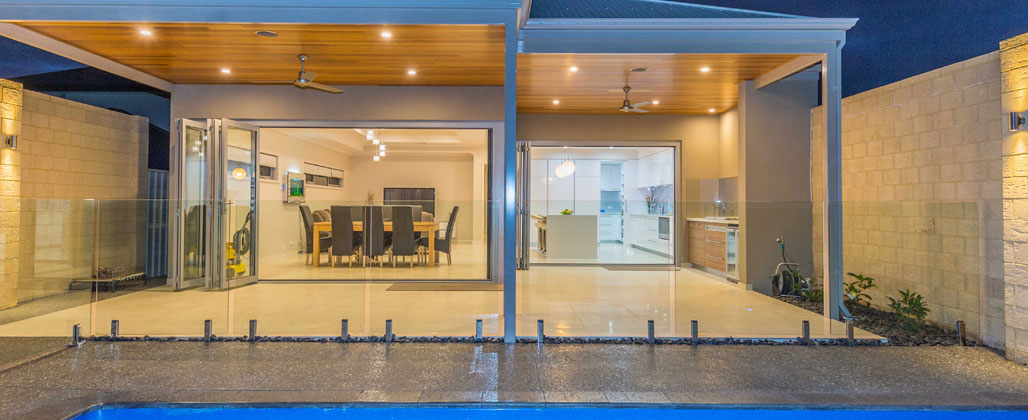 Stack Doors Opening To A Pool Area